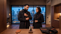 Digital lifestyle visualisation of a couple wearing dark clothing indoors in front of a city skyline; not all four suite components are shown.
